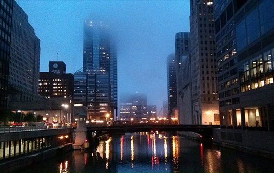 River in the city with mist